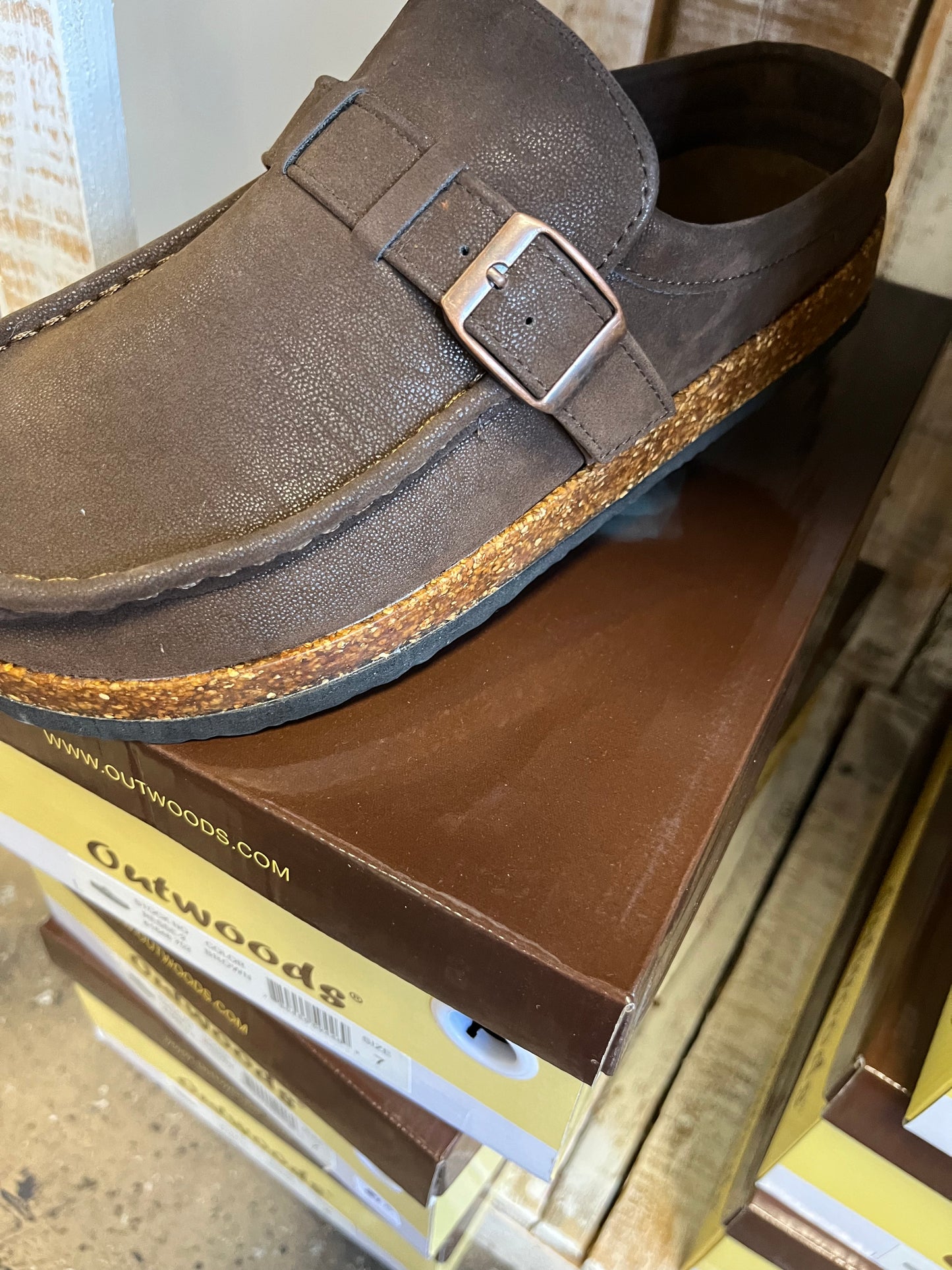 Brown buckle slip on